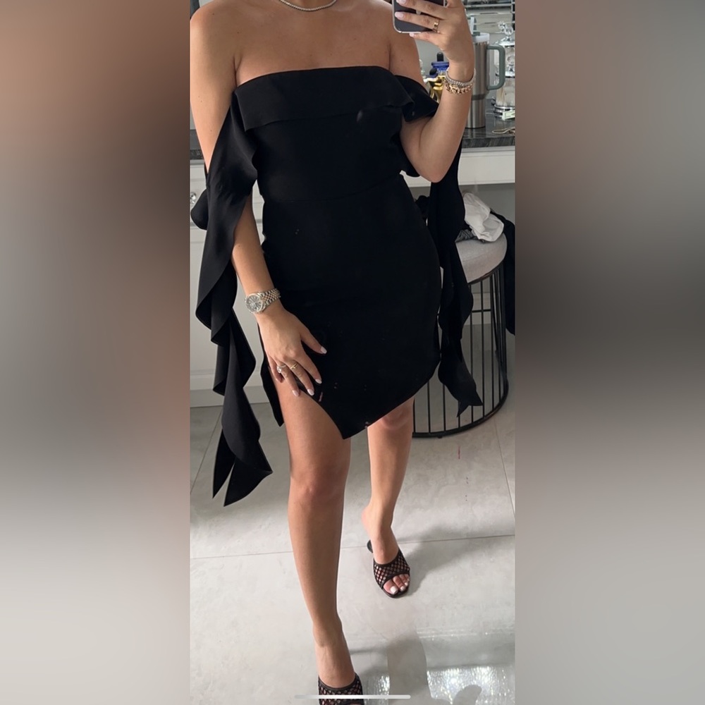 Elegant black dress with dramatic hanging sleeves